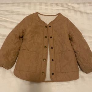 Heavy and warm quilted and Sherpa lined jacket in camel color.